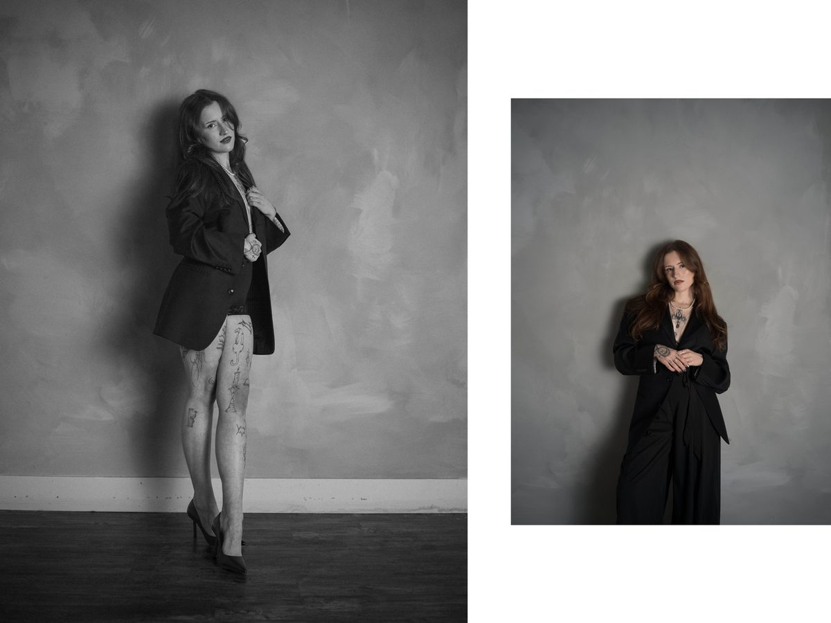 Spread 2 of 7 from The Apprentice: two photographs of a tattooed woman in a black blazer and heels against a textured wall; black and white.