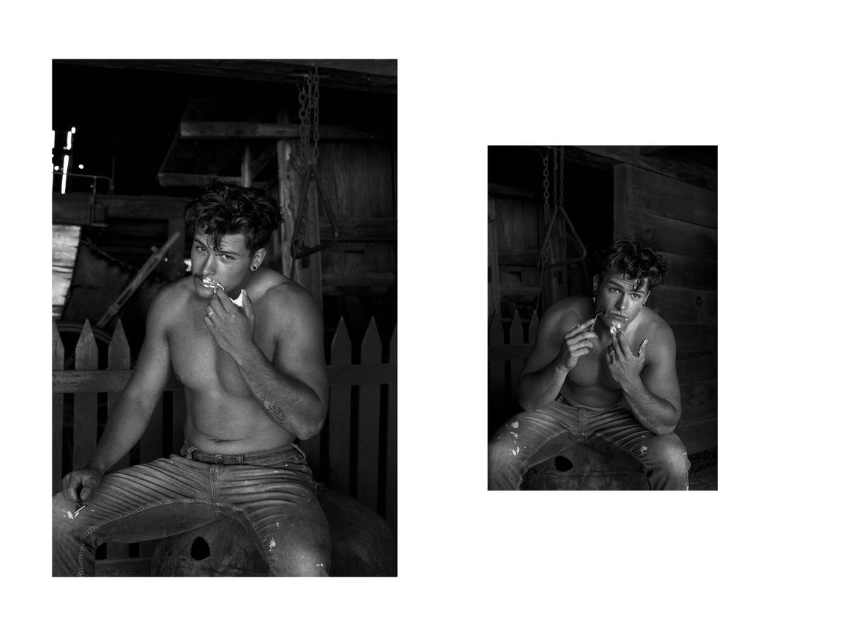 Spread 1 of 12 from On The Road: two photographs of a young man smoking in a rustic shed, seated on a barrel in striped trousers; black and white.