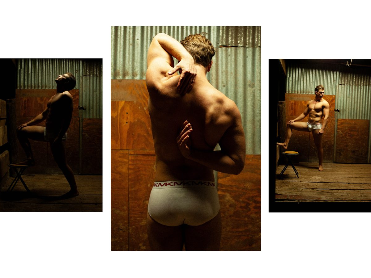 Spread 5 of 6 from The Woodsman: three photographs of a young man in briefs in a workshop, one seen from behind, one standing on a stool; colour, low light.